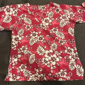 a pair of Scrub tops size small